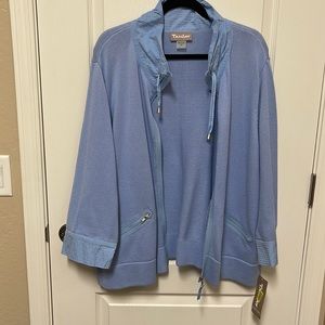 Light blue cotton zip up sweater with two zip up pockets.